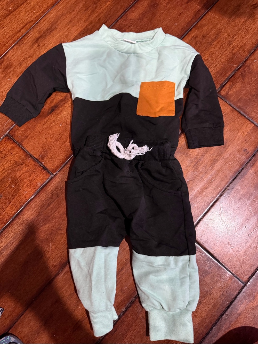 Source Unknown Mint and Black Colorblock One-Piece with Orange Pocket